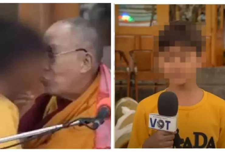 niño besado por el Daláil Lama