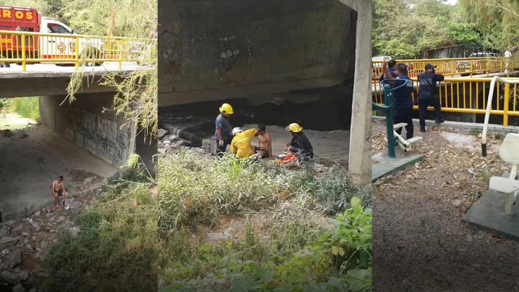 Hombre herido debajo de un puente siendo atendido por rescatistas.
