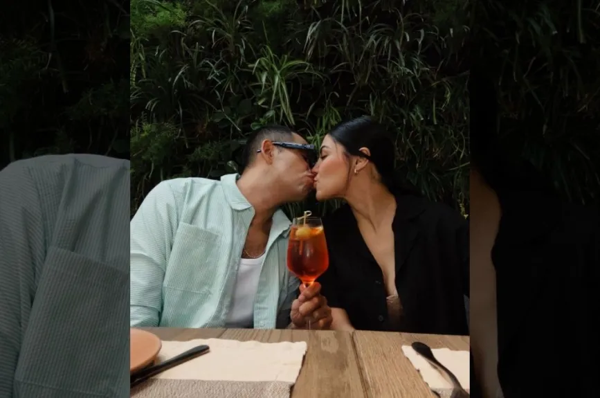 Capi y su esposa beso.jpg