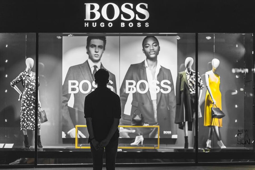 man-standing-in-front-of-boss-hugo-boss-store.jpg