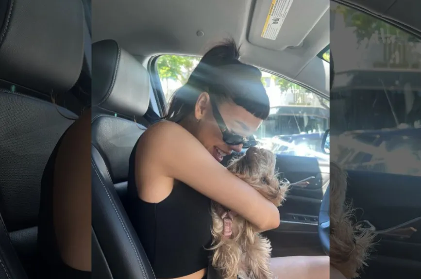 Danna abrazando a su perro.jpg