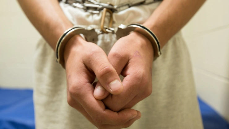 Teenage boy in shackles