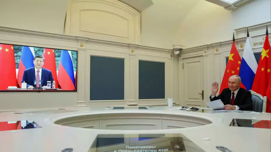 Los presidentes de China, Xi Jinping, y de Rusia, Vladimir Putin, en videoconferencia.