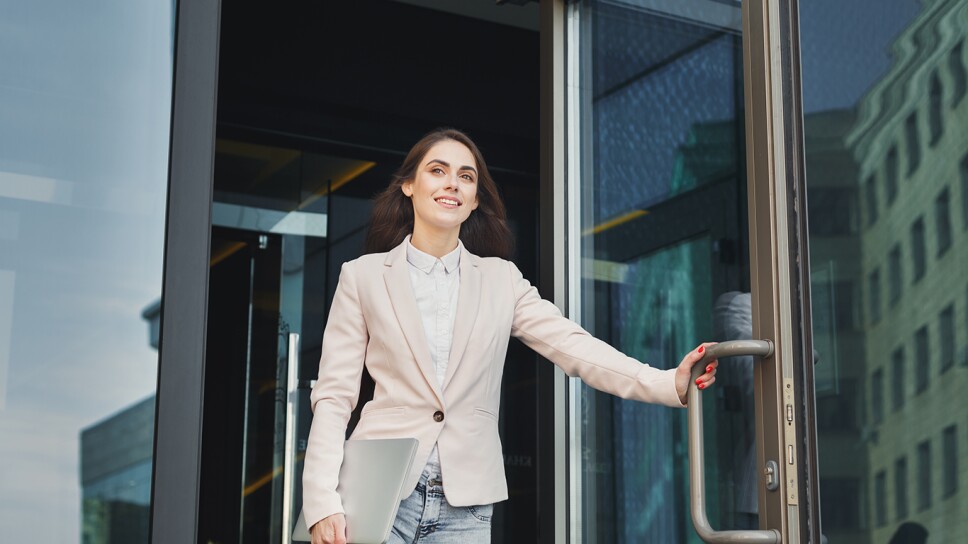 Confident young businesswoman talking on mobile