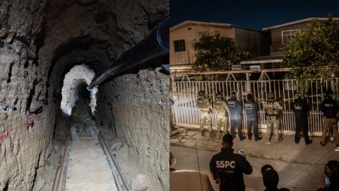 Una vista profunda de un túnel subterráneo estrecho y oscuro con paredes de tierra rugosas. En el centro del túnel, hay un conjunto de vías simples sobre una base de arena o tierra, con una figura tumbada en una especie de carrito o plataforma en las vías, mirando hacia el fondo del túnel. Un tubo oscuro y grueso corre a lo largo del techo del túnel en el lado derecho.
