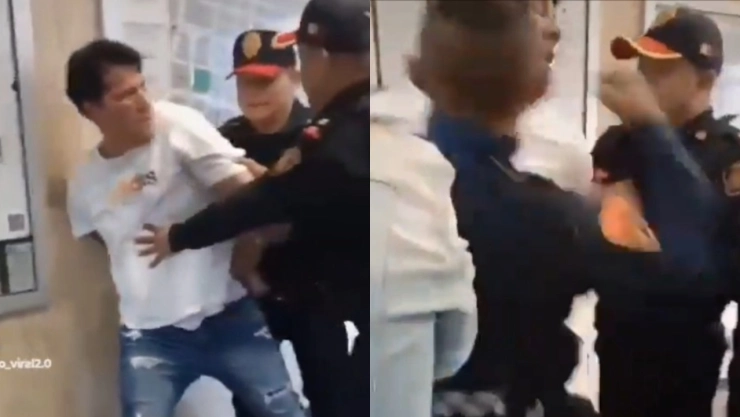 Los policías forcejearon con el hombre al que le fueron colocados los candados de mano.