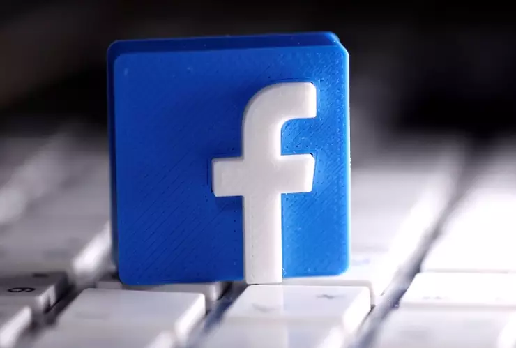 FILE PHOTO: A 3D-printed Facebook logo is seen placed on a keyboard in this illustration