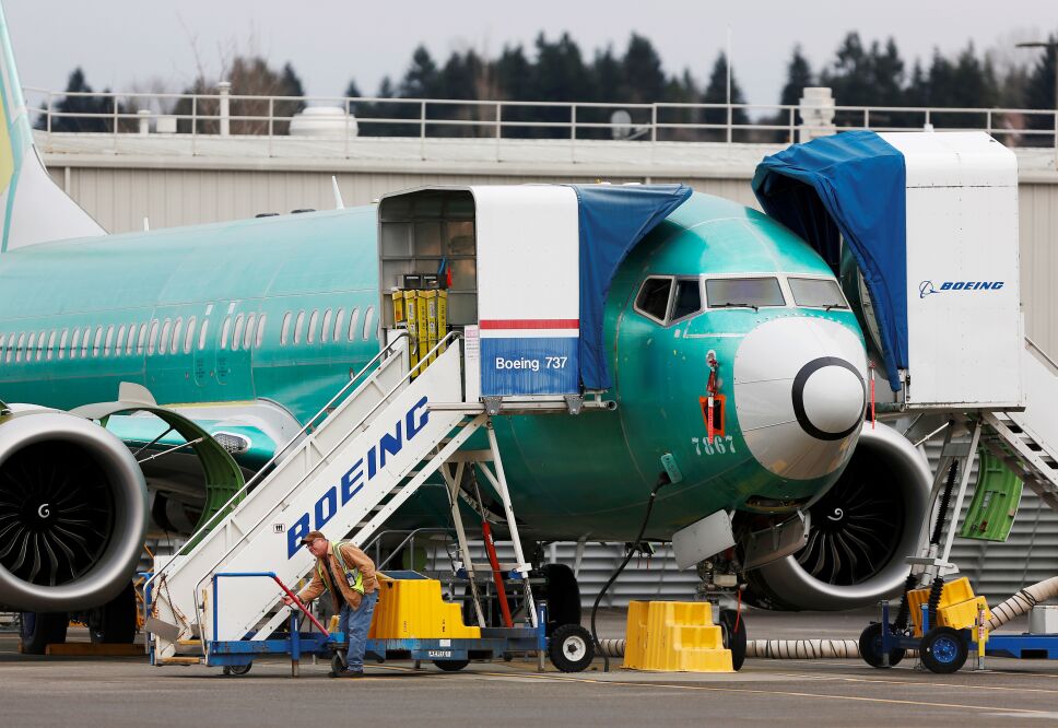 FILE PHOTO: An employee works near a Boeing 737 Max aircraft at Boeing’s 737 Max production facility in Renton, Washington