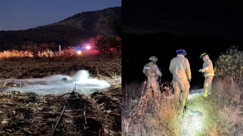 Bomberos y soldado atendiendo fuga de gas en terreno baldío en El Zapote, Tepeji del Rio. Hidalgo.