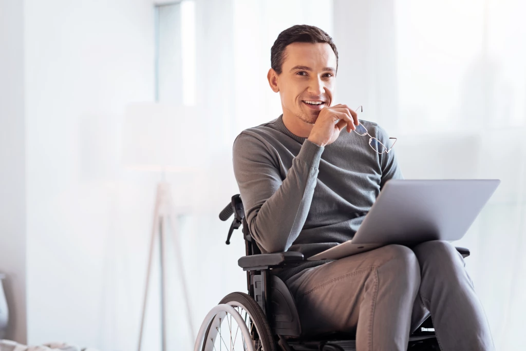 Positive delighted disabled man looking forward