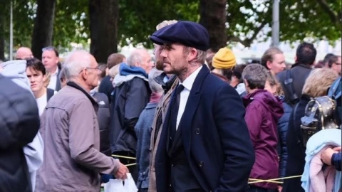 David Beckham fila reina Isabel II
