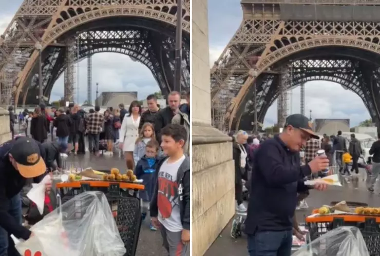 captan a hombre vendiendo elotes con sal al pie de la torre eiffel en paris francia.jpg