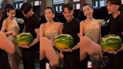 Kenia OS y Peso Pluma reciben un insólito regalo en Nueva York: una sandía tallada con sus rostros