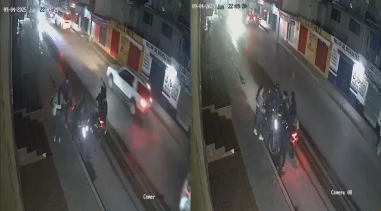 Una cámara de seguridad capta el momento de un asalto en calles de Ecatepec. Tres sujetos abordo de una moto se llevaron las pertenencias de una pareja que se iba a subir a su moto.