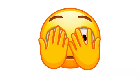 Emoji mirando a escondidas