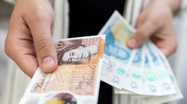 Illustration shows British Pound banknotes