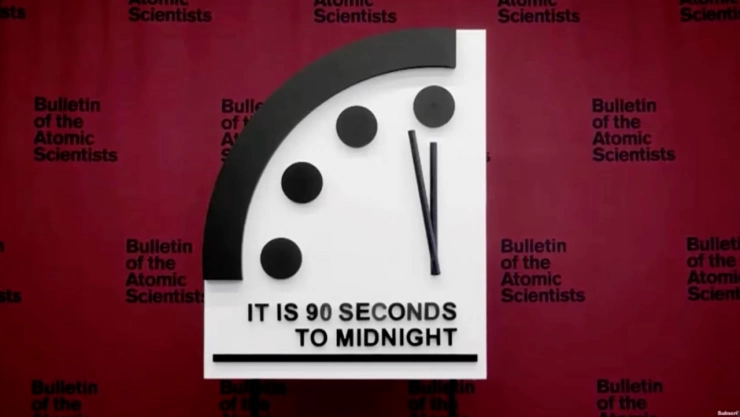 Imagen de las manecillas del Reloj del Fin del Mundo acercándose a la medianoche, representando el peligro inminente de una catástrofe global.