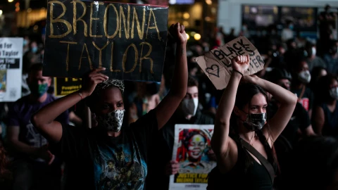 People participate during a march following the announcement of a single indictment in the Breonna Taylor case, in New York City