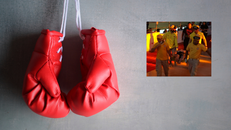 Guantes de box rojos colgados en una pared