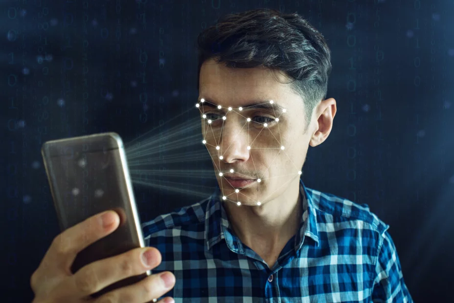 Man is trying to access the phone using the personal identification method of face recognition