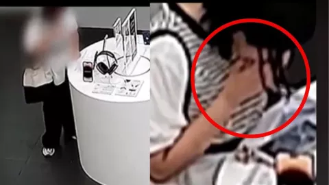 Mujer roba celular a mordidas