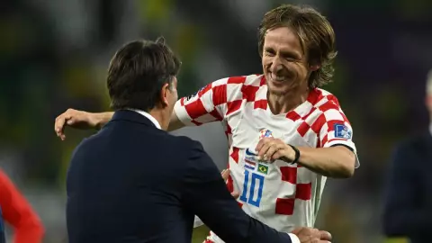Luka Modric celebra con su DT Zlatko Dalic