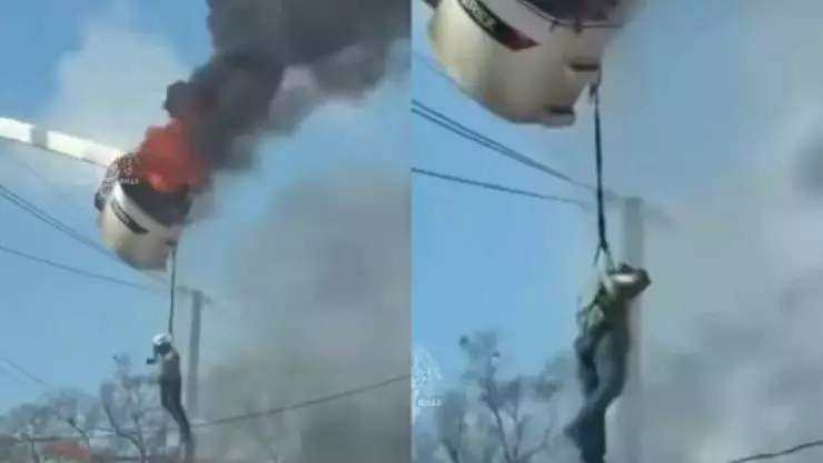 ¡Aterrador! Trabajador queda colgando de un camión en llamas mientras lucha su vida | VIDEO