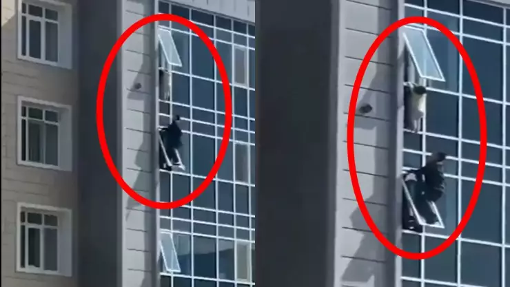 Rescatan a niño a punto de caer de edificio