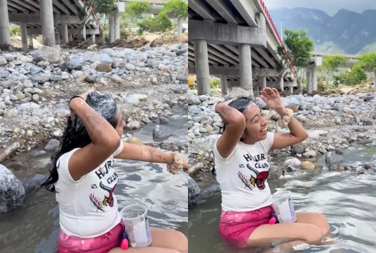 Joven aprovecha la lluvia y se baña en el río porque no tiene agua en su casa