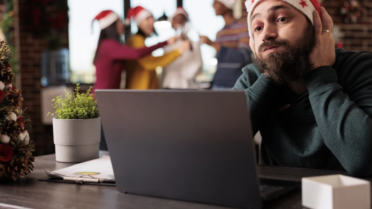 Worker having burnout in xmas office