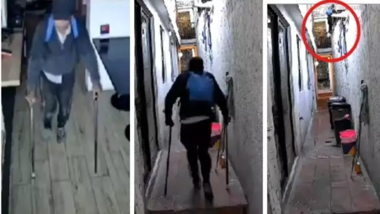 Ladrón en muletas escala muro para robar en restaurante