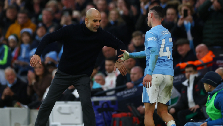 Pep Guardiola y Phil Foden