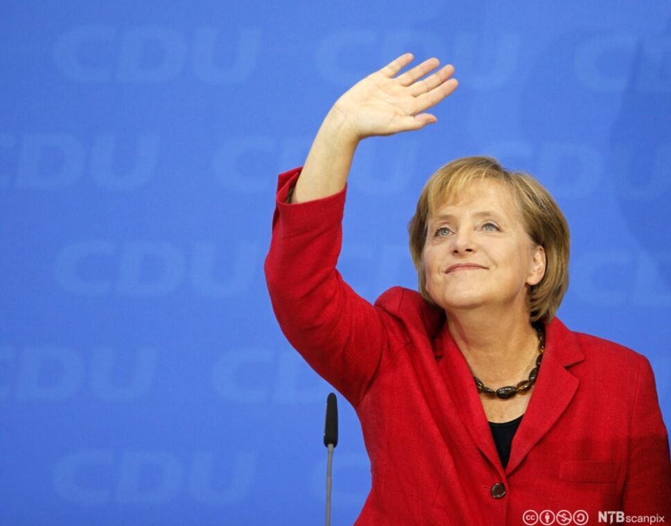 Angela Merkel, German Chancellor and leader of the conservative Christian Democratic Union party (CDU) waves to her supporters after first exit polls in the German general election (Bundestagswahl) at party headquarters in Berlin