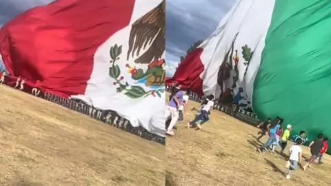 VIDEO_ Niños evitan que Bandera de México toque el piso.jpg