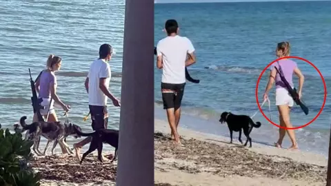 VIDEO Captan a turista paseando con un rifle en playas de Yucatán