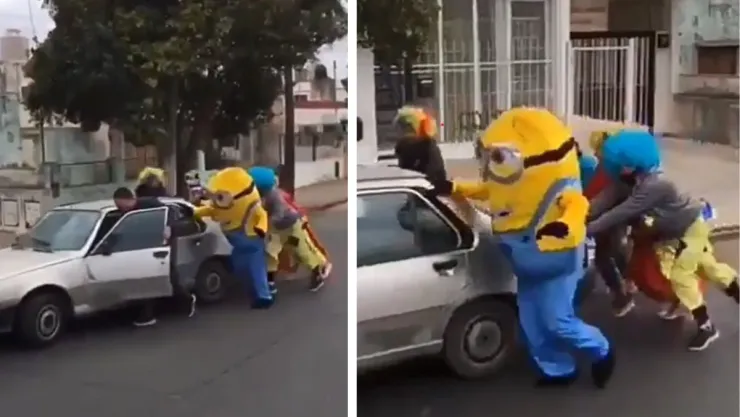 Superhéroes en acción: Minion, payasito y Spiderman unen fuerza para ayudar a empujar un carro.