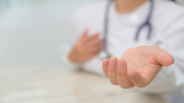 Doctor holding something in his hand