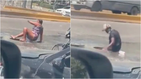 VIDEO_ ¡Increíble! Familia se mete a las coladeras para refrescarse y se hace viral
