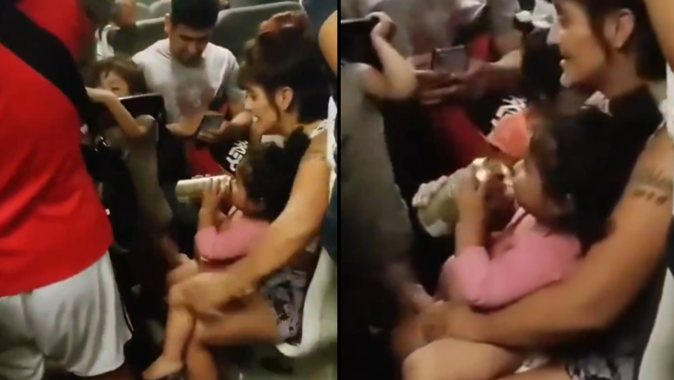 mujer le da cerveza a su bebé