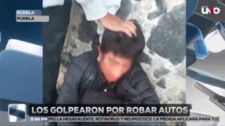Los golpearon por presuntamente robar autos en Puebla.jpg