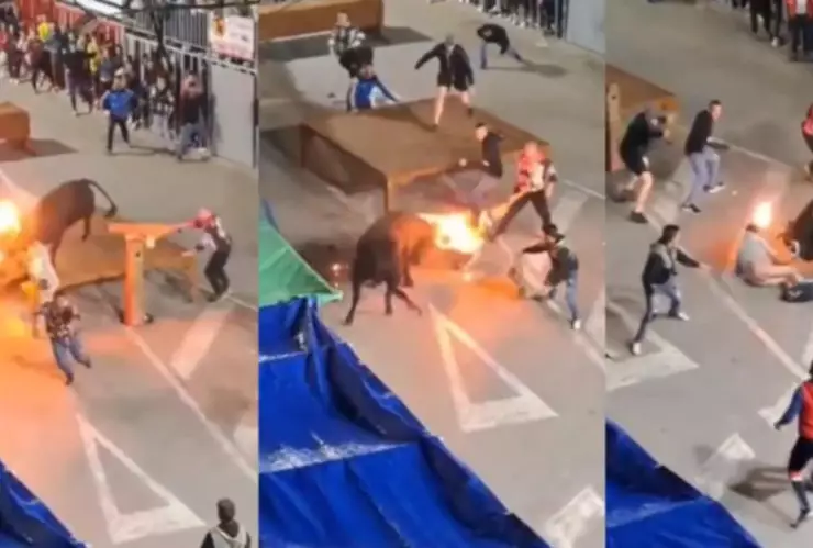 Hombre es embestido por un toro con fuego en los cuernos