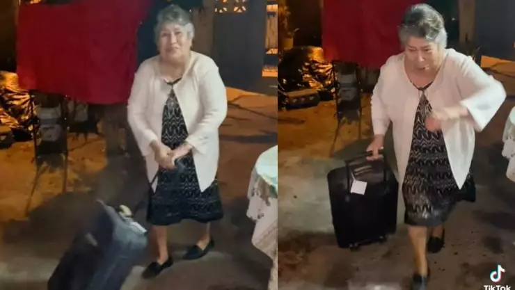 VIDEO Abuelita sale con maletas en Año Nuevo y se mete por balazos