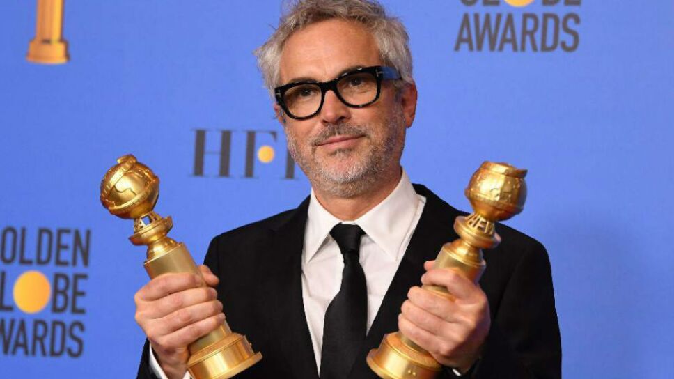 Cuarón con sus Globos de Oro / Foto: Especial