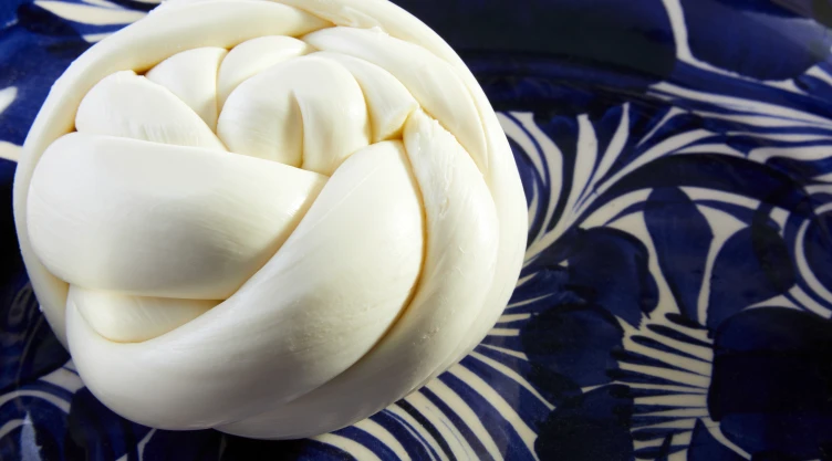 Traditional,Delicious,Oaxaca,Cheese,Or,Quesillo,Over,A,Typical,Blue